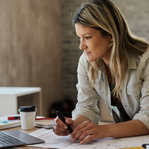 Female Architectural Technologist working in office