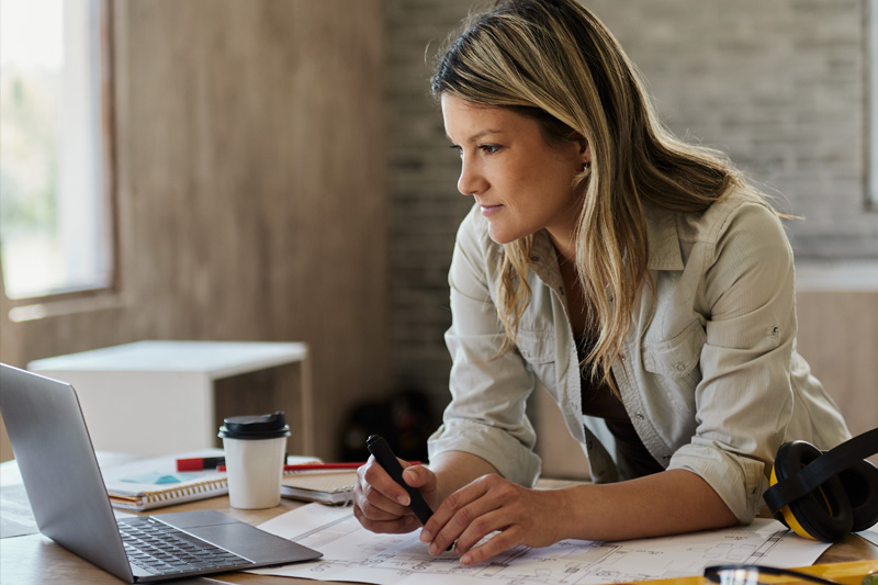 Female Architectural Technologist working in office